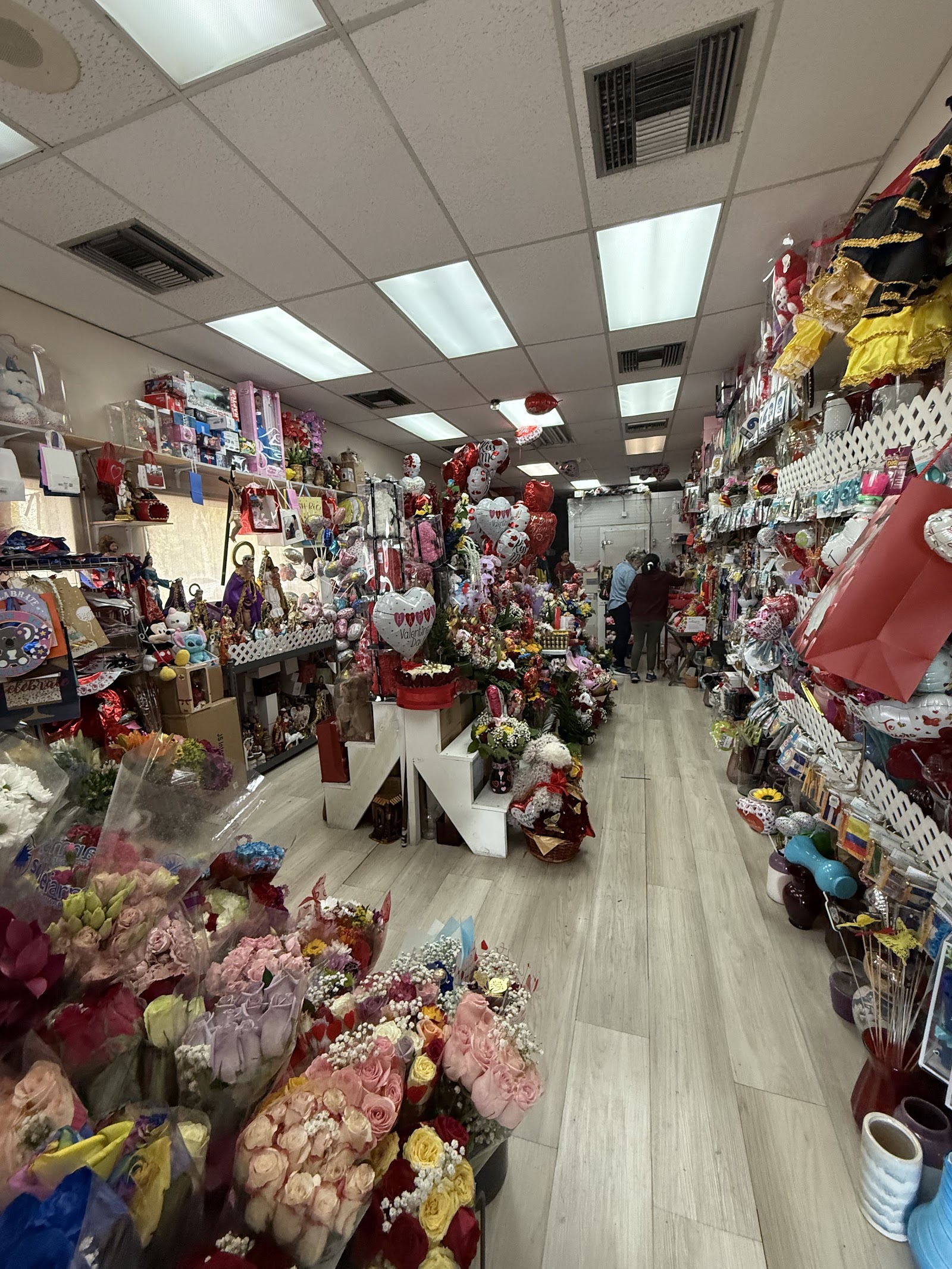 Inside Roxy Flowers: shelves of roses, bouquets and gifts